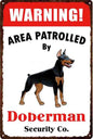 DOBERMAN PLAQUE WARNING AREA PATROLLED BY DOBERMAN 